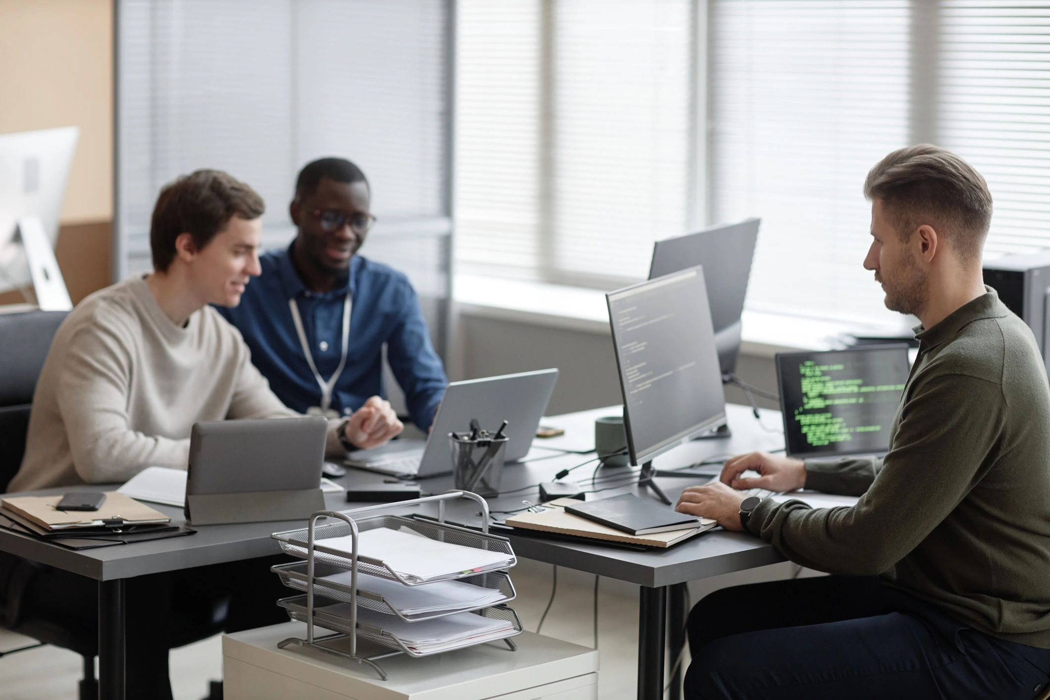 IT professionals working together in a modern support office